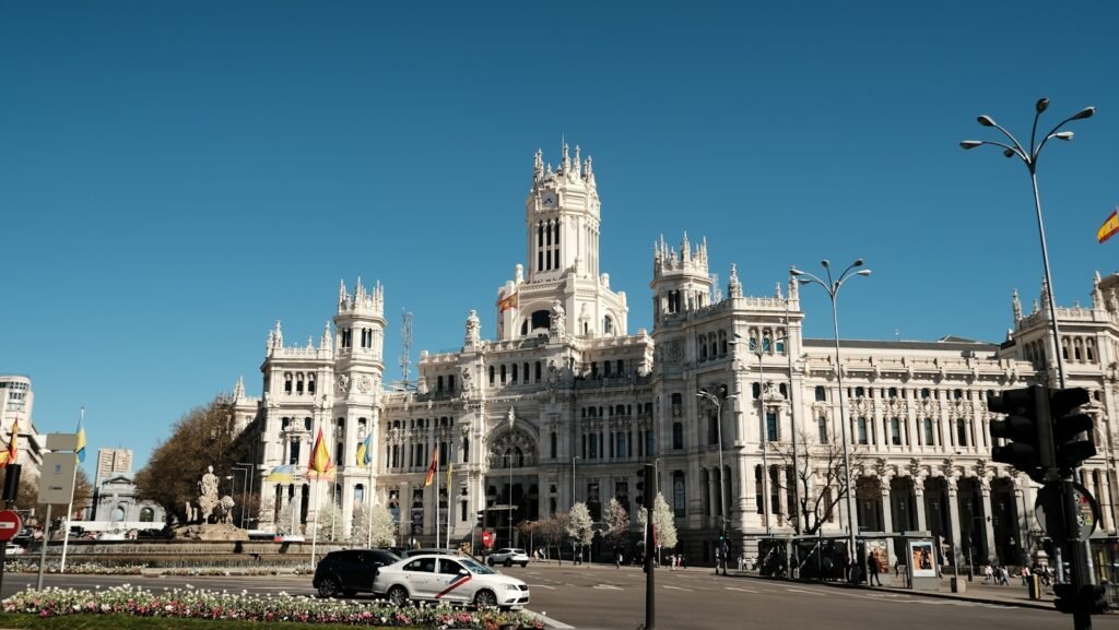 a large white building with a clock tower